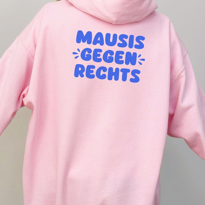May include: Pink hoodie with a blue graphic that says "MAUSIS *GEGEN* RECHTS"