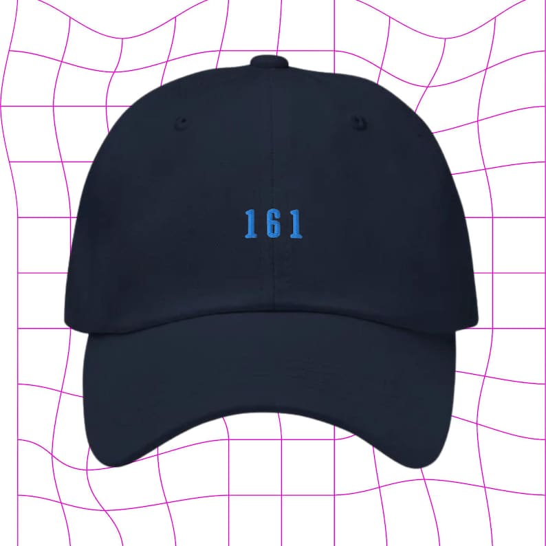 May include: A navy blue baseball cap with a blue embroidered number "161" on the front.