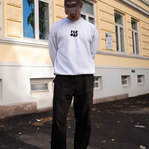 FCK MRZ Pullover – Statementtrui tegen rechtse agitatie en Merz-ideologie | Unisex streetwear met attitude | Biologisch katoen en eerlijke mode afbeelding 3