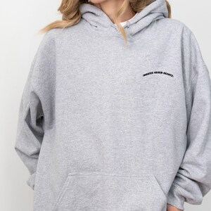 May include: A gray hooded sweatshirt with the text "MAUSIS GEGEN RECHTS" embroidered on the front.