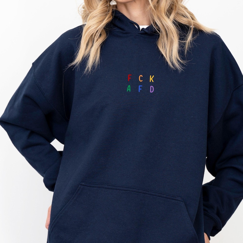 May include: A navy blue hooded sweatshirt with a rainbow embroidered design that spells out "FCK AFD".
