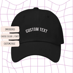 May include: Black baseball cap with white embroidered text that says "CUSTOM TEXT". The cap is customizable with different colours and fonts.