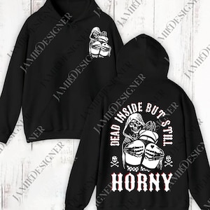 May include: Black hoodie with a white graphic of a skeleton in a hooded robe, with the text "DEAD INSIDE BUT STILL HORNY". The design is repeated on the front. The hoodie has a drawstring hood and a kangaroo pocket.