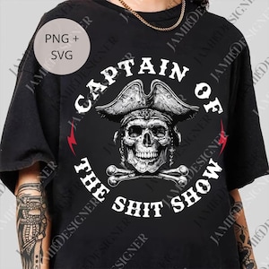 May include: Black t-shirt with a pirate skull wearing a hat, and the words "CAPTAIN OF THE SHIT SHOW" in a circle. Includes a PNG + SVG graphic.