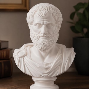 May include: A white bust of a man with a beard and curly hair. The sculpture is on a pedestal and has a draped garment over the shoulders. The bust is likely made of plaster or a similar material and is a classical art piece.