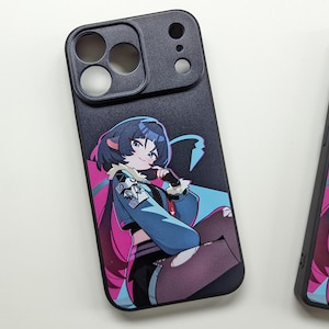 May include: Black smartphone case with a colourful anime-style illustration of a character with blue hair, a blue jacket, and pink accents. The case has a camera lens protector.