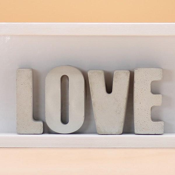 Decorated Christian table with engraved letters "LOVE".