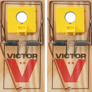 May include: Two wooden mouse traps with a yellow plastic trigger and a metal spring. The traps are labeled "PROFESSIONAL" and "VICTOR" in red and black lettering.