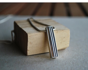 Silver men's pendant with ebony and olive wood