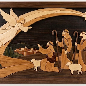 May include: A rectangular wooden wall art piece featuring an intarsia scene of an angel appearing to three shepherds with sheep in a landscape. The design uses various wood tones to depict a star, a distant town, and figures in a dark frame.