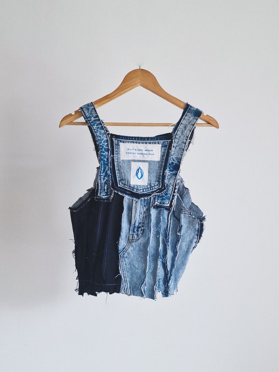 Tie up - Distressed denim clit vest, made of upcycled materials.