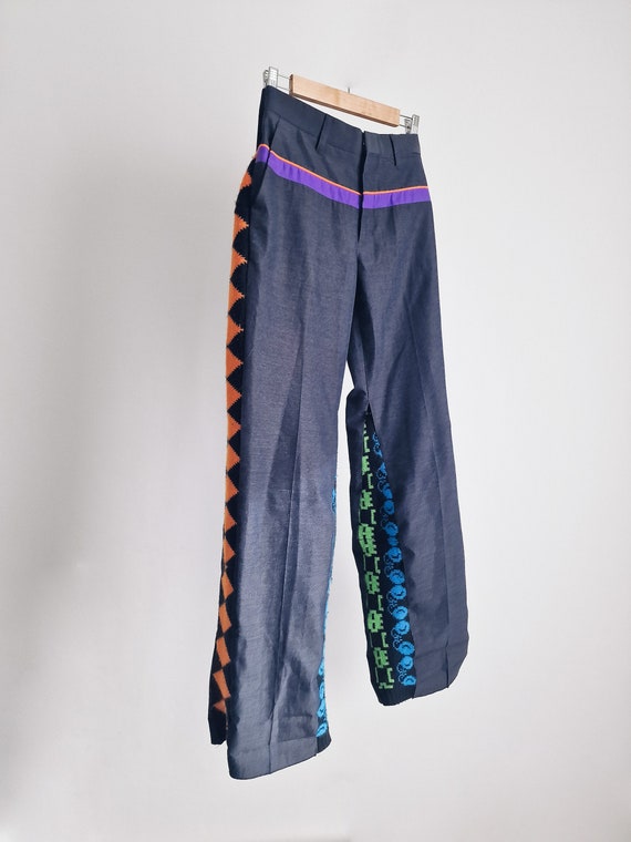 Upcycled trousers with a flare, handmade out of second hand pants and an aztec colorful cardigan, slow fashion