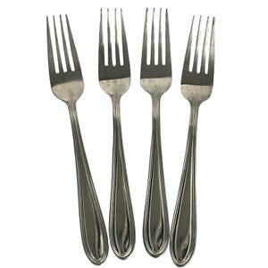 May include: Four silver forks with a classic design. Each fork has four tines and a long, teardrop-shaped handle. The forks are made of a shiny, reflective metal. The forks are arranged against a white background.