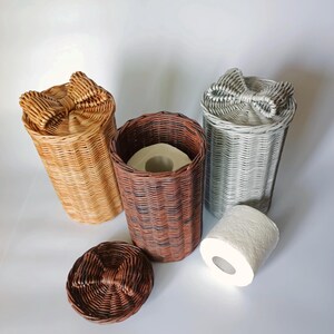 Three woven toilet roll holders in neutral tones; brown basket shown with toilet paper inside for scale. Ideal rustic bathroom decor