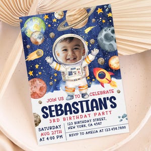 May include: A blue and white space-themed birthday invitation with a photo of a child dressed as an astronaut. The invitation says "Join us to celebrate Sebastian's 3rd Birthday Party" with details for the party.