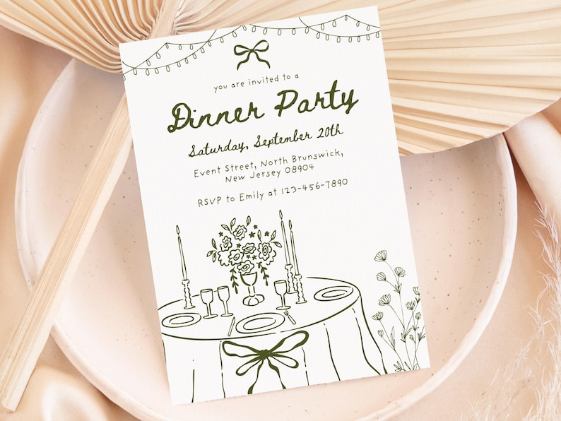May include: A white invitation card with a green illustration for a dinner party. The card features the text "Dinner Party" and event details. The illustration includes a table setting with flowers, candles, and a bow.