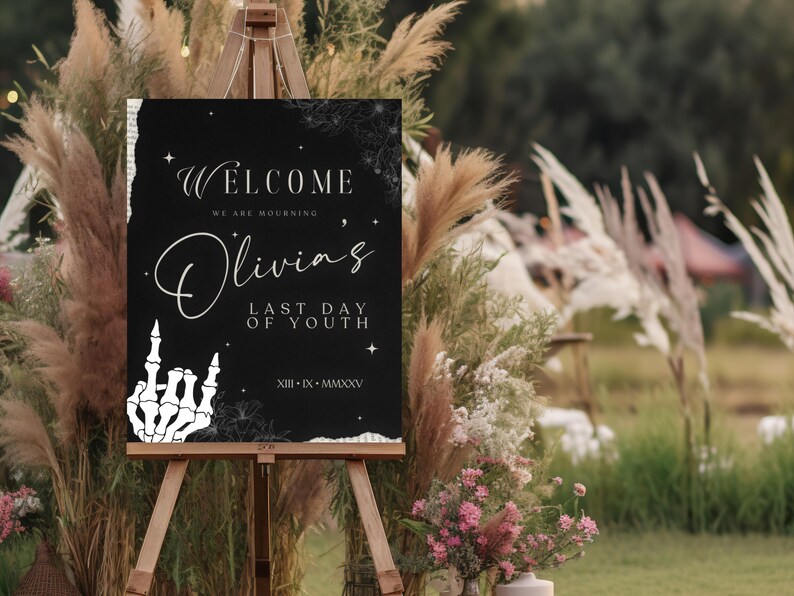 May include: Black and white welcome sign with a skeleton hand making a rock and roll gesture. The sign reads "Welcome, We are mourning Olivia's Last Day of Youth, XIII-IX-MMXXV".