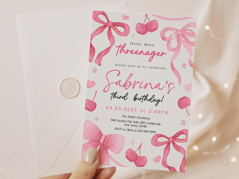 May include: Pink birthday invitation with watercolor illustrations of bows, cherries, and hearts. The text reads "little miss threenager" and "Sabrina's third birthday!" with the date and time of the party.