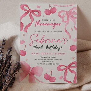 May include: Pink birthday invitation with a watercolor design featuring cherries, bows, and stars. The text reads "little miss Threenager" and "Sabrina's third birthday!" with the date and time of the party.