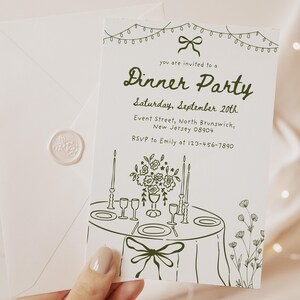 May include: A white dinner party invitation with green ink illustrations. The invitation includes the text "Dinner Party" and event details. An envelope with a wax seal is also visible.