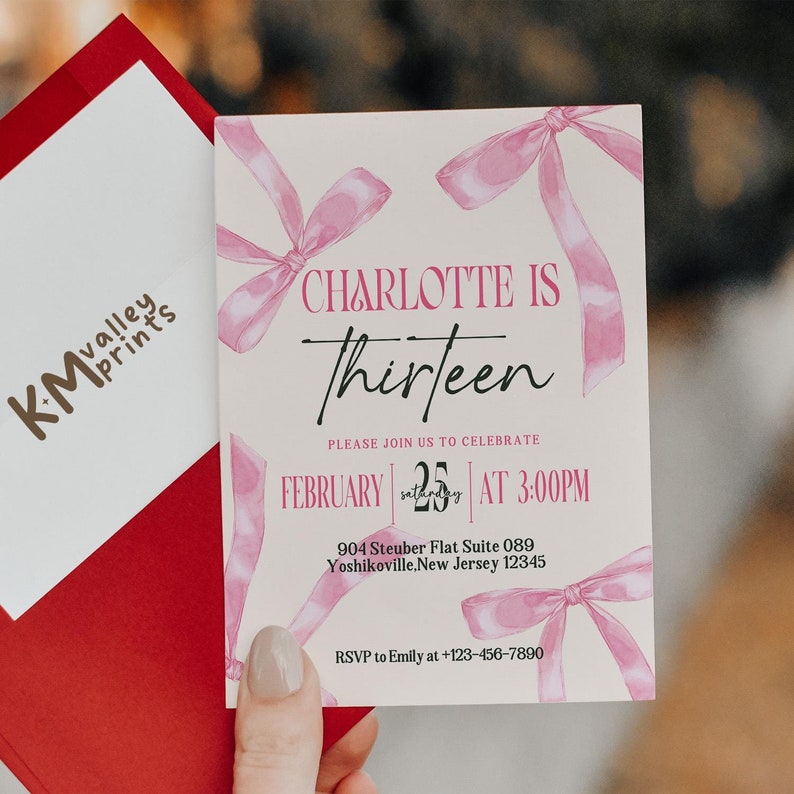 May include: Pink invitation card with a white background and pink ribbon bows. The text on the card reads "Charlotte is Thirteen" and includes the date "February 25th" and time "3:00PM".