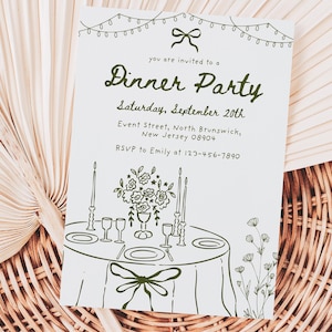 May include: A white invitation card with green text and illustrations for a dinner party. The card includes the text "Dinner Party", date, time, location, and RSVP information. The card is decorated with illustrations of a table setting, flowers, and string lights.