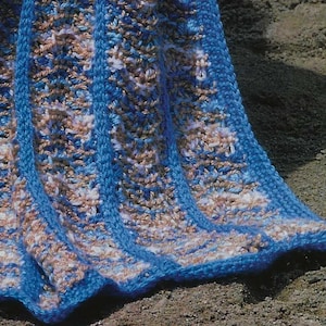 May include: A blue and brown striped crocheted blanket with a textured pattern. The blanket is folded and draped over a surface.