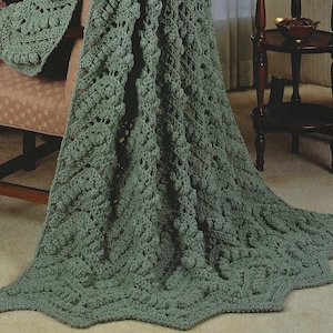 May include: A set of three ceramic mugs with a speckled, matte finish. The mugs are in shades of cream, light gray, and dark gray. Each mug has a simple, minimalist design, perfect for coffee or tea. The mugs are approximately 4 inches tall.