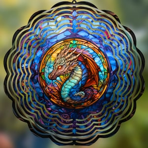 May include: A colorful metal wind spinner with a stained glass design of a blue and gold dragon. The dragon is surrounded by a circular pattern of blue, purple, and gold.