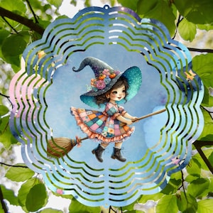 May include: A whimsical metal wind spinner featuring a young witch riding a broom. The witch wears a patchwork dress and a large hat adorned with flowers. The design is set against a blue background and framed by a decorative, scalloped edge.
