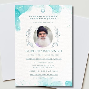 May include: A memorial card with a portrait of a man in a black turban and glasses, surrounded by a floral wreath. The card has a watercolor-style teal and white background with text in English and another language. The card reads "In Loving Memory of Gurucharan Singh."