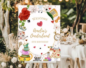 May include: Welcome to Amelia's Wonderland 6th Birthday party sign with a white background and gold lettering. The sign features a whimsical illustration of Alice in Wonderland characters, including the Mad Hatter, the Cheshire Cat, and the White Rabbit.