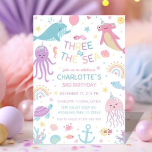 May include: A pastel-colored birthday invitation with the text "THREE by THE SEA" and "CHARLOTTE'S 3RD BIRTHDAY." The design features cartoon sea creatures like a whale, octopus, and jellyfish, along with rainbows and stars. The invitation includes event details.