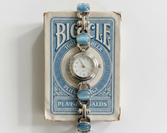 2000s Y2K watch with turquoise glass cabochons.