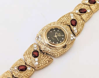 Vintage-Armbanduhr aus den 80er Jahren in Gold, Armband mit Rubin-Cabochon und Struktur.
