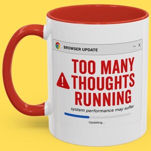 May include: White ceramic mug with a red interior and handle. The mug features a browser update window with the text "TOO MANY THOUGHTS RUNNING" in red, along with a warning icon and the words "system performance may suffer."