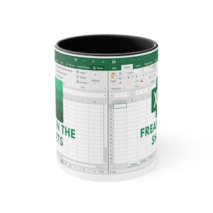 May include: White ceramic mug with a black interior and the words "IN THE SHEETS" and "FREAKING SHEETS" printed on it. The mug features a design resembling a spreadsheet interface.