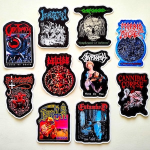 a collection of stickers featuring various graphic designs and text related to heavy metal music, including bands and album titles.