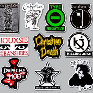 May include: A collection of ten die-cut vinyl stickers featuring band logos and imagery including Joy Division, Cocteau Twins, Type O Negative, Bauhaus, Siouxsie and the Banshees, Christian Death, Killing Joke, Depeche Mode, The Sisters of Mercy, and The Cure.
