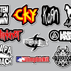 May include: A collection of ten die-cut vinyl stickers featuring various rock and metal band logos including System of a Down, CKY, Korn, Deftones, Slipknot, Drowning Pool, Linkin Park, Papa Roach, Limp Bizkit, and Disturbed in black, white, red, and yellow.