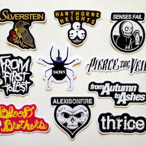 a collection of stickers with various designs and text, including a skull and crossbones, a bird, and other graphic elements.