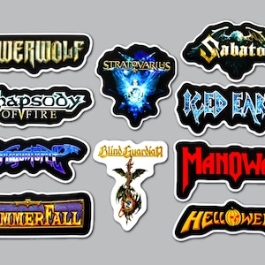 May include: A collection of ten die-cut vinyl stickers featuring heavy metal band logos including Powerwolf, Stratovarius, Sabaton, Rhapsody of Fire, Iced Earth, Dragonforce, Blind Guardian, Manowar, Hammerfall, and Helloween with various color schemes.