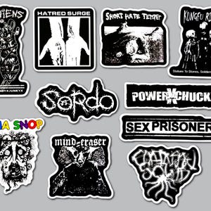 May include: A collection of ten black and white stickers featuring various graphic designs and band names including Chiens, Hatred Surge, Short Hate Temper, Kungfu Rick, Sordo, Power Chuck, Sex Prisoner, Ona Snop, Mind Eraser, and Capitalist Casualties.