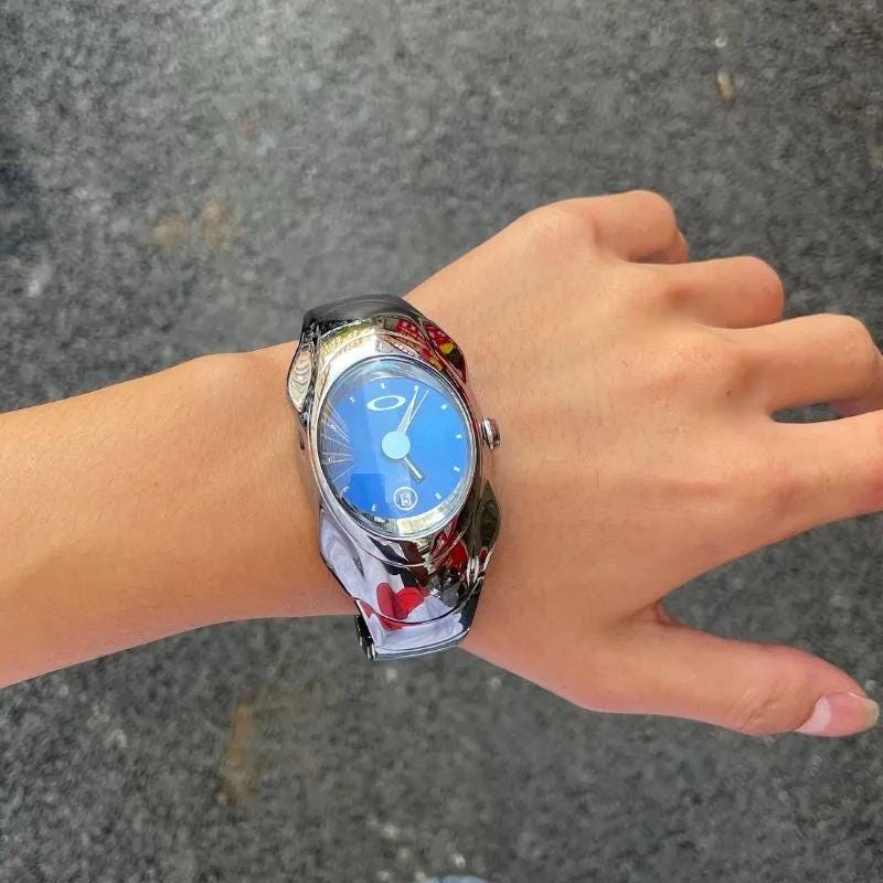 Stylish Oakley Watch: Glossy Silver Case With Blue Dial | Modern