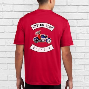 May include: Red t-shirt with a white graphic of a cartoon character riding a motorcycle with the text "CUSTOM CLUB CITY" on the back.