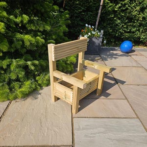 May include: A wooden planter chair with a slatted back and a single planter box. The chair is made of natural wood and has a rustic look.