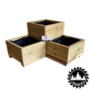 May include: A three-tiered wooden planter with black fabric liners. The planter is made of natural wood and has a rustic look.