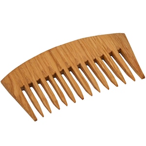 May include: A wooden comb with a curved handle and wide teeth. The comb is made of light brown wood and has a natural finish.