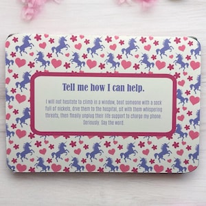 May include: A white card with a pink border and a unicorn pattern. The card has a pink and white box with the text "Tell me how I can help." and a humorous message about helping someone in need.