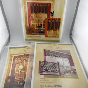 May include: Three sewing pattern packets from Show Home Patterns by Pate-Meadows Designs. The top packet shows the Dana Valance. The bottom left packet shows the Pull-Up Valance. The bottom right packet shows the Erin Valance with full-size patterns.